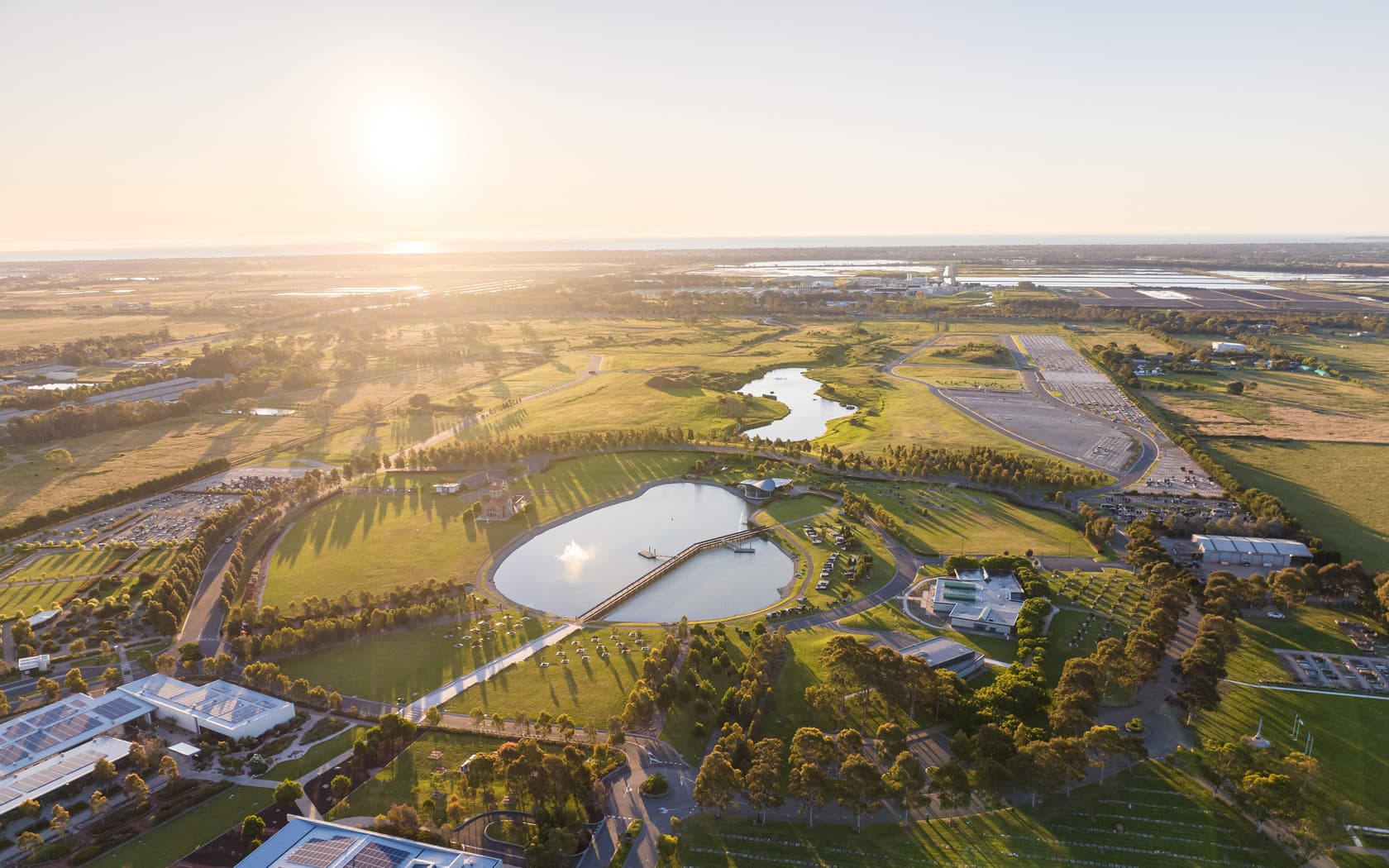 Aerial sunset view over Lake Australis at Bunurong Memorial Park