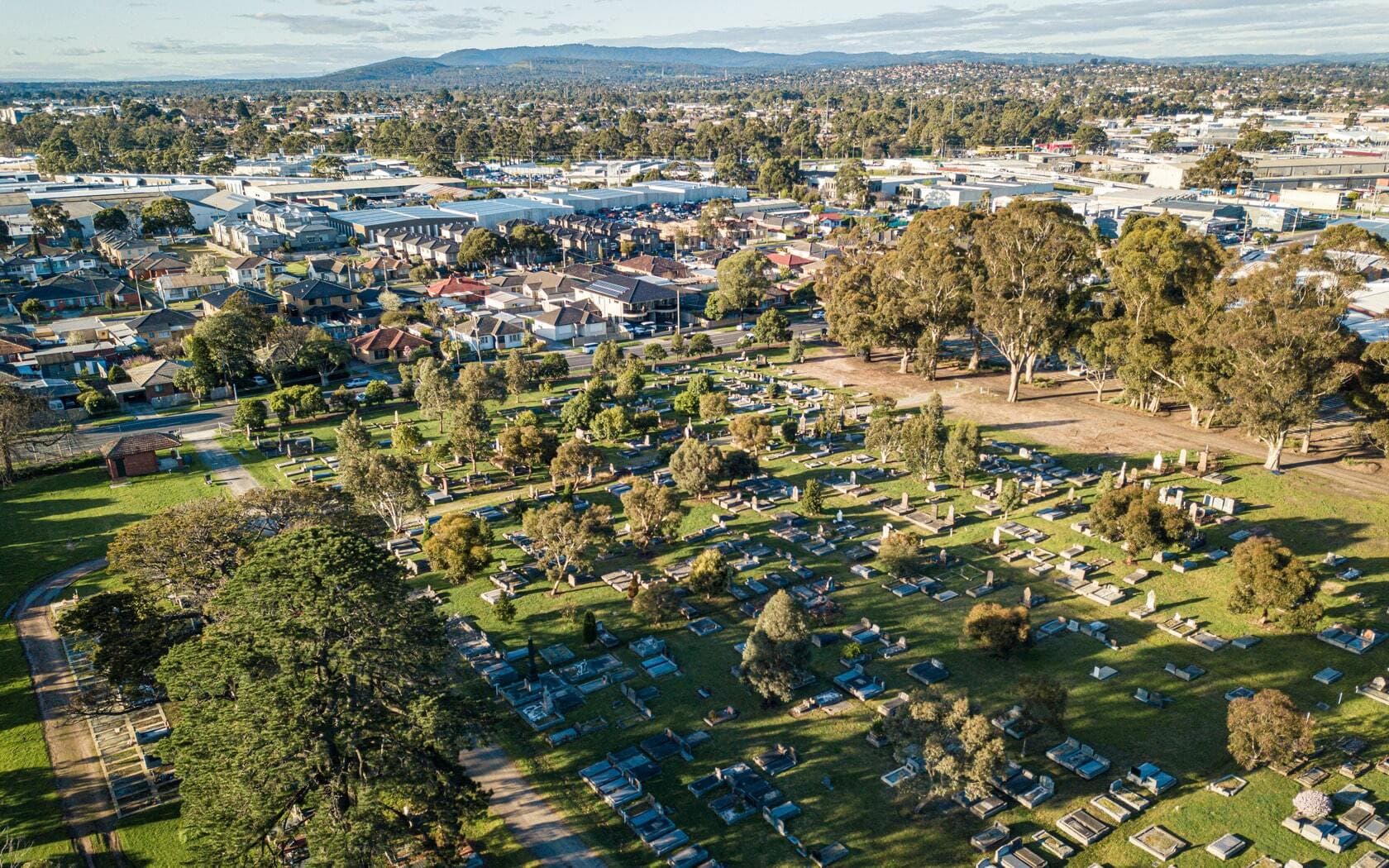 Dandenong Community Cemetery drone shot with mountains in the background