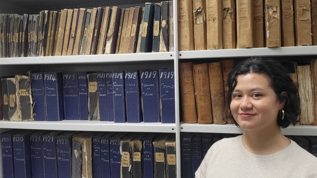 Picture of Eva in the records room at Springvale Botanical Cemetery.